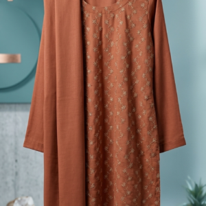 . A woman in an elegant orange suit, featuring a matching jacket and pants, showcasing traditional Asian fashion.